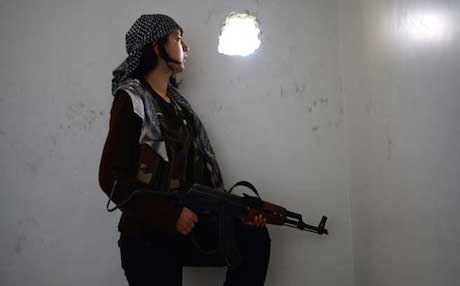 A woman fighter in the YPG forces.