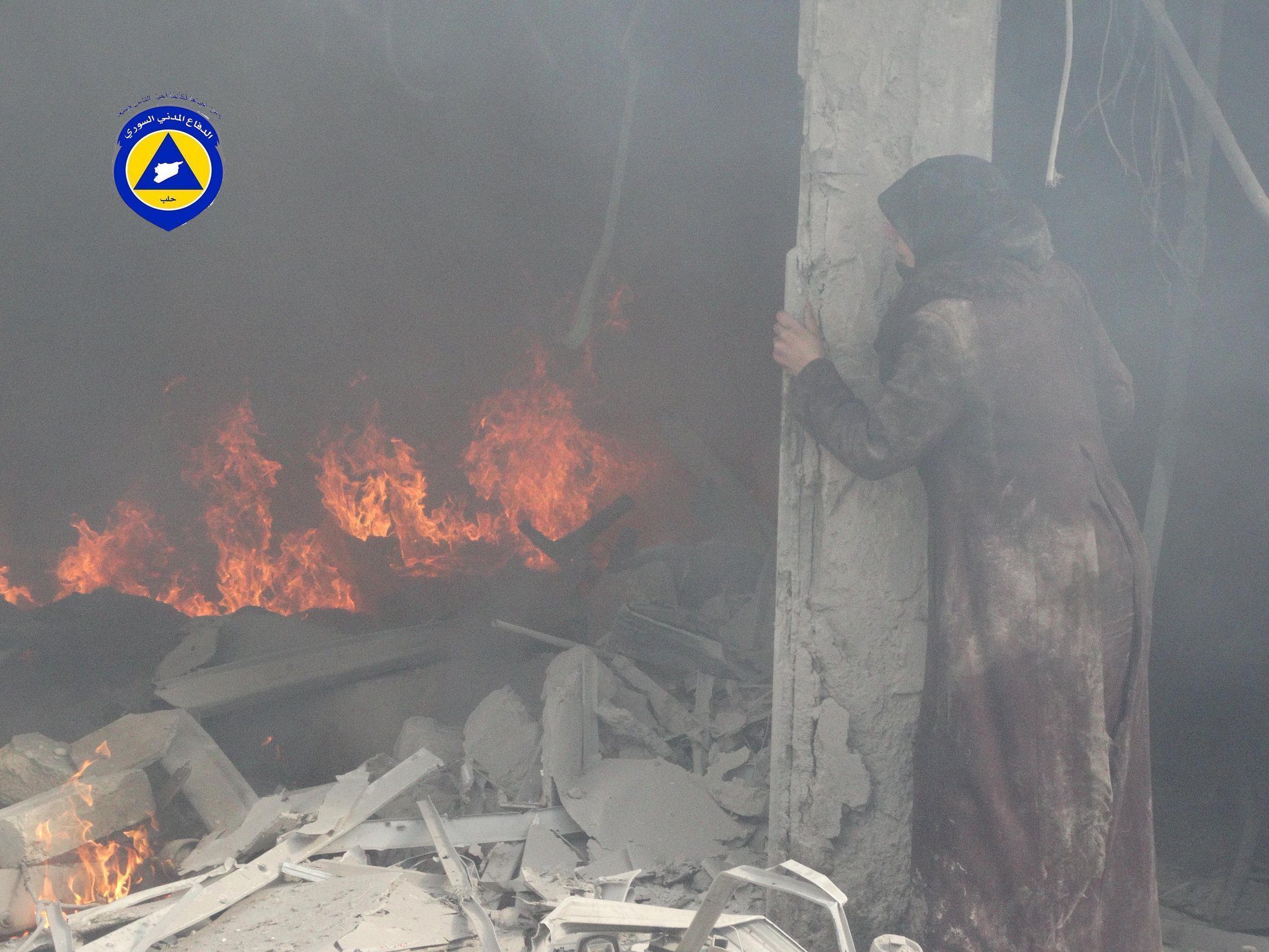 Looking at her father as he was burning under the rubble of his home in #Aleppo. Jun-2014