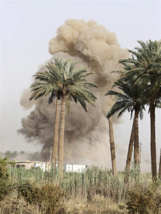 Smoke rises from clashes with ISIS militants in Saqlawiya, north of Falluja, Iraq, on June 3