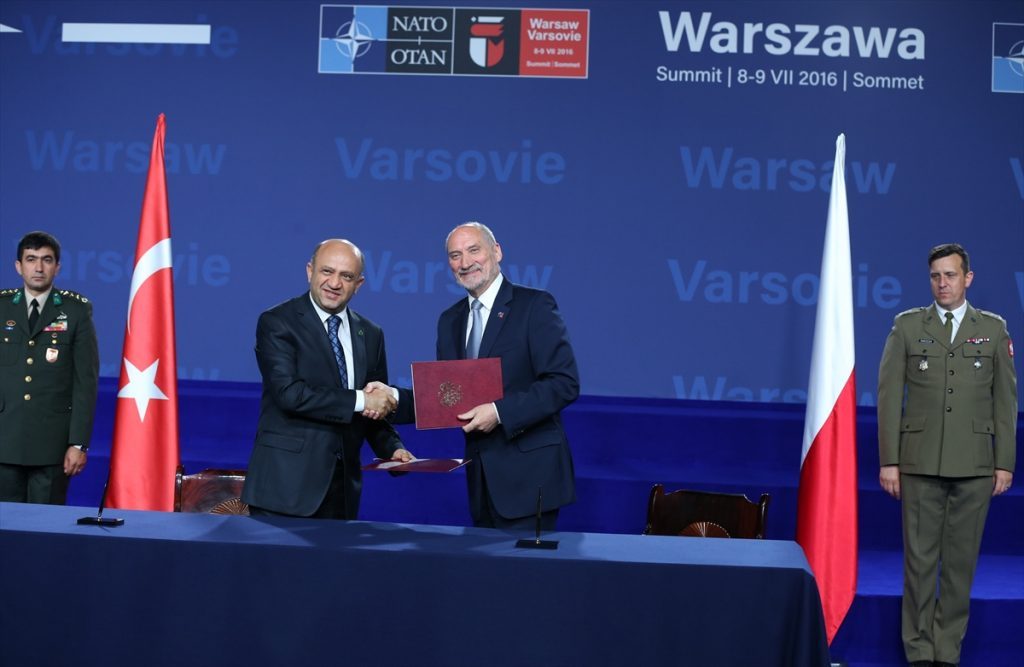 Polish Defence Minister Antoni Macierewicz and Turkish Defense Minister Fikri Isik sign a joint declaration on expanding electronic warfare capabilities in Warsaw, Poland on July 09, 2016.