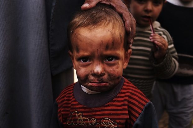 a Syrian Refugee child in a camp in Lebanon