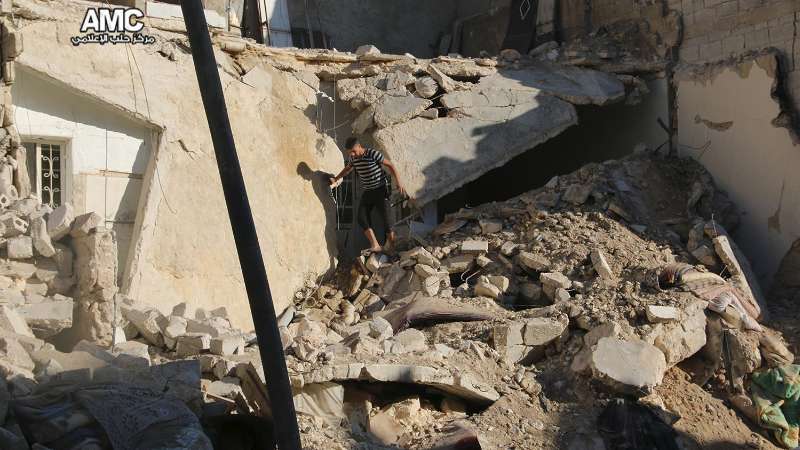 A man among destructed houses in Tareeq al-Bab neighborhood after the Assad-Russian attacks, Sept. 23, 2016 - AMC