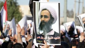 protester holds a poster of Shiite cleric Nimr al-Nimr, who was executed in Saudi Arabia, Jan., 2016